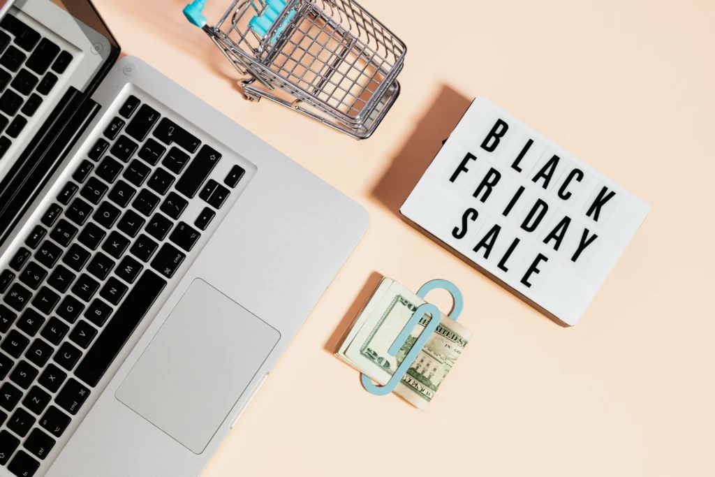 Black Friday sale tag with a laptop and money