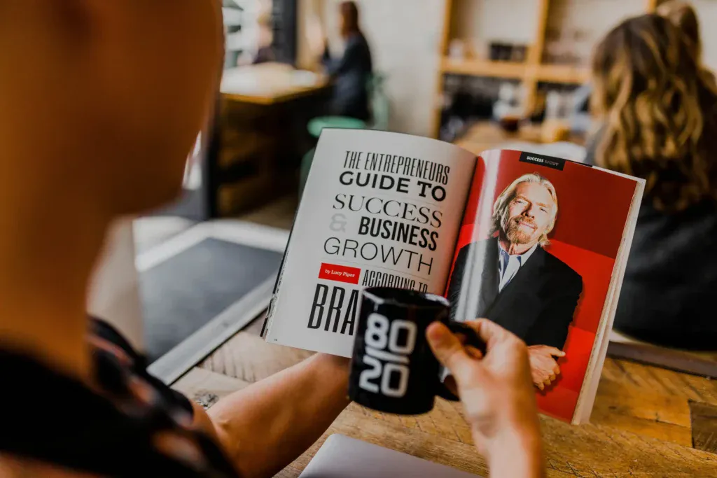 A man reading book guide to success and business growth